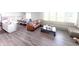 Open-concept living space with a modern kitchen, dining area, and comfortable seating for entertaining at 2358 S Stonehill Way, New Palestine, IN 46163