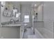 Bright bathroom with double sinks, subway tile shower and neutral color palette at 250 N Home Ave, Franklin, IN 46131