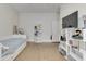 Neutral bedroom featuring hardwood floors, a day bed and white shelves at 250 N Home Ave, Franklin, IN 46131