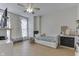 Bright bedroom featuring a daybed with storage, hardwood floors, and a large window, creating a cozy atmosphere at 250 N Home Ave, Franklin, IN 46131
