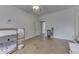 Spacious bedroom featuring bunk beds, wood floors, and natural light, complemented by an interior door at 250 N Home Ave, Franklin, IN 46131