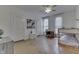 Bright bedroom with wood floors features two white doors, a ceiling fan, and natural light from windows at 250 N Home Ave, Franklin, IN 46131