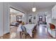 Open dining area with hardwood floors, connecting to the living room, creating an inviting space for entertaining at 250 N Home Ave, Franklin, IN 46131