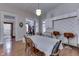 Dining room featuring hardwood floors, a built-in bar area, and an open layout connecting to other living spaces at 250 N Home Ave, Franklin, IN 46131