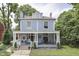 Charming two-story home boasts a classic facade with a covered front porch for outdoor seating at 250 N Home Ave, Franklin, IN 46131