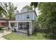 Angle of a two-story home featuring a spacious covered front porch for outdoor seating at 250 N Home Ave, Franklin, IN 46131