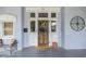 Charming front porch with seating area and decorative details, including a decorative door at 250 N Home Ave, Franklin, IN 46131