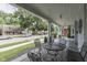 Inviting covered front porch furnished with a table and chairs for relaxing and enjoying the neighborhood at 250 N Home Ave, Franklin, IN 46131