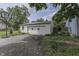View of the two-car garage with a basketball hoop and a paved driveway at 250 N Home Ave, Franklin, IN 46131