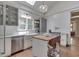 Bright, modern kitchen with stainless steel appliances, island, and subway tile backsplash at 250 N Home Ave, Franklin, IN 46131
