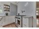 Kitchen with stainless steel range, granite countertops, and subway tile backsplash at 250 N Home Ave, Franklin, IN 46131
