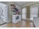 Practical laundry room with washer, dryer, and storage shelving at 250 N Home Ave, Franklin, IN 46131