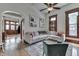 Inviting living room with large sectional couch and view to entry hall at 250 N Home Ave, Franklin, IN 46131