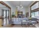 Bright living room featuring hardwood floors, a decorative fireplace, and a comfortable seating area with large windows at 250 N Home Ave, Franklin, IN 46131
