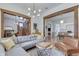 Spacious living room with hardwood floors, comfortable gray sofa, and classic architectural details throughout the home at 250 N Home Ave, Franklin, IN 46131