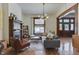 Inviting living room showcasing hardwood floors, fireplace, comfortable seating, and classic architectural details at 250 N Home Ave, Franklin, IN 46131