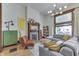 Living room with hardwood floors, a decorative fireplace, a gray sectional sofa, and stylish lighting fixtures at 250 N Home Ave, Franklin, IN 46131