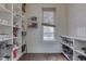Bright pantry with open shelving for storage, subway tile backsplash, and natural light from a window at 250 N Home Ave, Franklin, IN 46131