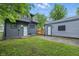 Backyard featuring a garage and partial lawn area, with the house in the background at 2720 S Taft Ave, Indianapolis, IN 46241