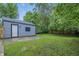 View of backyard with a detached garage and a concrete slab, perfect for outdoor seating at 2720 S Taft Ave, Indianapolis, IN 46241