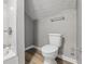 Well-lit bathroom featuring a toilet and a tiled shower with modern fixtures at 2720 S Taft Ave, Indianapolis, IN 46241