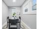Dining room with four chairs, gray walls, and light wood flooring at 2720 S Taft Ave, Indianapolis, IN 46241