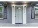 Close-up of the front door with decorative glass and modern lighting at 2720 S Taft Ave, Indianapolis, IN 46241