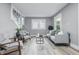 Bright living room with gray walls, light-colored floors, and modern furnishings at 2720 S Taft Ave, Indianapolis, IN 46241
