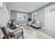 Bright living room with gray walls, light-colored floors, and modern furnishings at 2720 S Taft Ave, Indianapolis, IN 46241