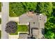 Overhead shot of a home with a beautiful backyard deck, well manicured lawn, and mature landscaping at 289 Sandbrook Dr, Noblesville, IN 46062
