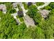 Beautiful bird's eye view of a property showcasing a backyard deck surrounded by mature trees at 289 Sandbrook Dr, Noblesville, IN 46062
