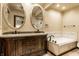 Elegant bathroom with a double vanity, soaking tub, and modern fixtures at 289 Sandbrook Dr, Noblesville, IN 46062