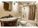 Traditional bathroom with granite vanity, wood accents, and a shower-tub combination at 289 Sandbrook Dr, Noblesville, IN 46062