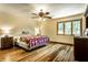 Cozy bedroom featuring a large window, ceiling fan, and ample natural light at 289 Sandbrook Dr, Noblesville, IN 46062