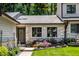 Charming home featuring a stone facade, beautiful landscaping, and a well-maintained front lawn at 289 Sandbrook Dr, Noblesville, IN 46062