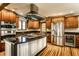 Gourmet kitchen features stainless steel appliances, granite countertops, and custom cabinetry at 289 Sandbrook Dr, Noblesville, IN 46062