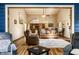 Open-concept living area with hardwood floors, fireplace, and a glimpse into the kitchen at 289 Sandbrook Dr, Noblesville, IN 46062