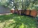 Backyard with mature trees, a hammock, and a privacy fence at 302 Penn St, Westfield, IN 46074