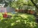 Shaded backyard with mature trees, a fire pit and hammock at 302 Penn St, Westfield, IN 46074