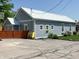 Single story home with metal roof, yellow entry door, and small yard at 302 Penn St, Westfield, IN 46074