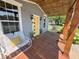 Inviting porch featuring seating, swing, and a yellow front door, perfect for relaxing outdoors at 302 Penn St, Westfield, IN 46074