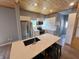 Spacious kitchen features stainless steel appliances, white cabinets, quartz countertops, and a large island at 302 Penn St, Westfield, IN 46074