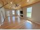 Sunlit living area boasting hardwood floors, a cozy fireplace, and a wood ceiling at 302 Penn St, Westfield, IN 46074