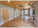 Spacious room with wood ceiling, wood floor, and stylish fireplace at 302 Penn St, Westfield, IN 46074