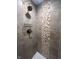 Updated shower stall featuring neutral tile and a decorative accent panel at 302 Penn St, Westfield, IN 46074