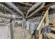 Unfinished basement with exposed pipes, water heaters, and concrete walls, ready for customization at 3028 Hovey St, Indianapolis, IN 46218