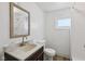 Updated bathroom featuring modern fixtures, a toilet, and natural light at 3028 Hovey St, Indianapolis, IN 46218