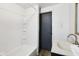 Bathroom features a shower and tub combo and a vanity at 3028 Hovey St, Indianapolis, IN 46218