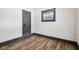 Cozy bedroom with new laminate flooring, white walls, and an accent trim for a contemporary look at 3028 Hovey St, Indianapolis, IN 46218