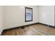 Bedroom with light wood-look flooring and a window at 3028 Hovey St, Indianapolis, IN 46218